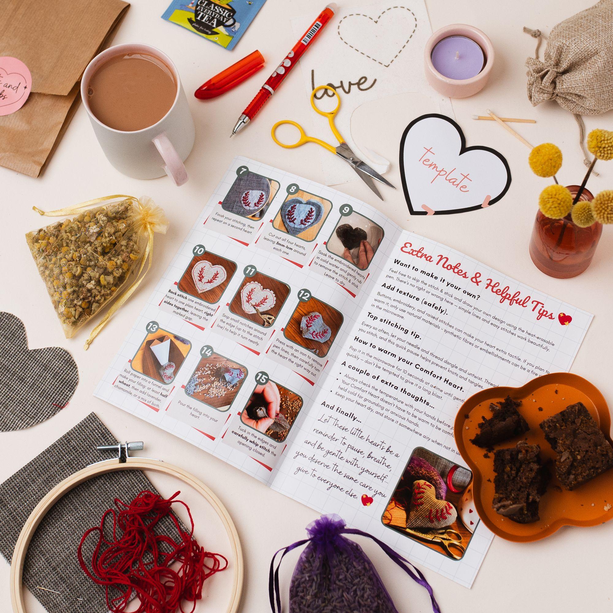 An open Teabreak box filled with a creative project, drinks, treats and thoughtful extras